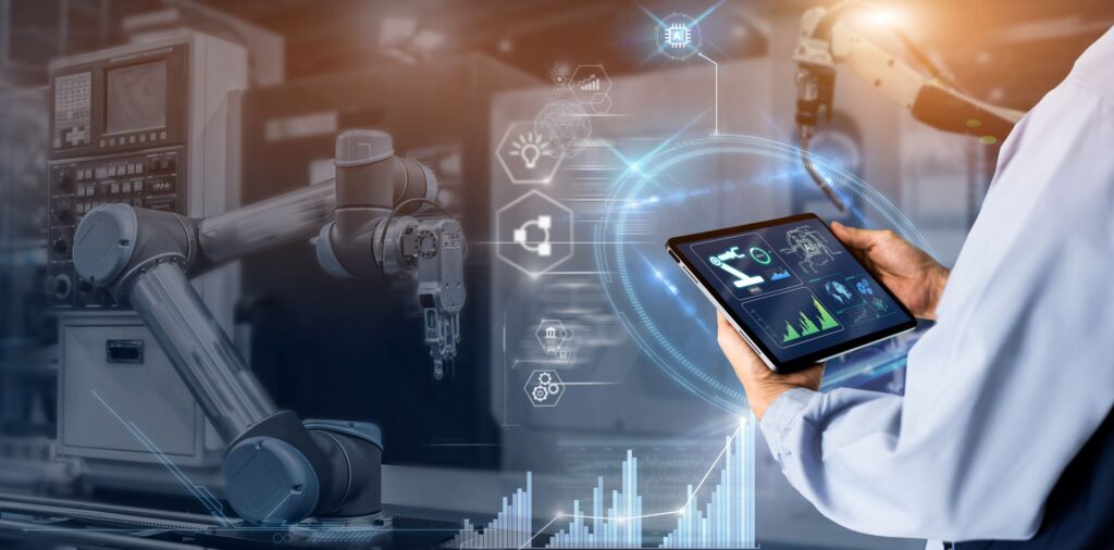 Techniker mit Tablet in einer modernen Produktionshalle ĂŒberwacht Sensorik und Messtechnik